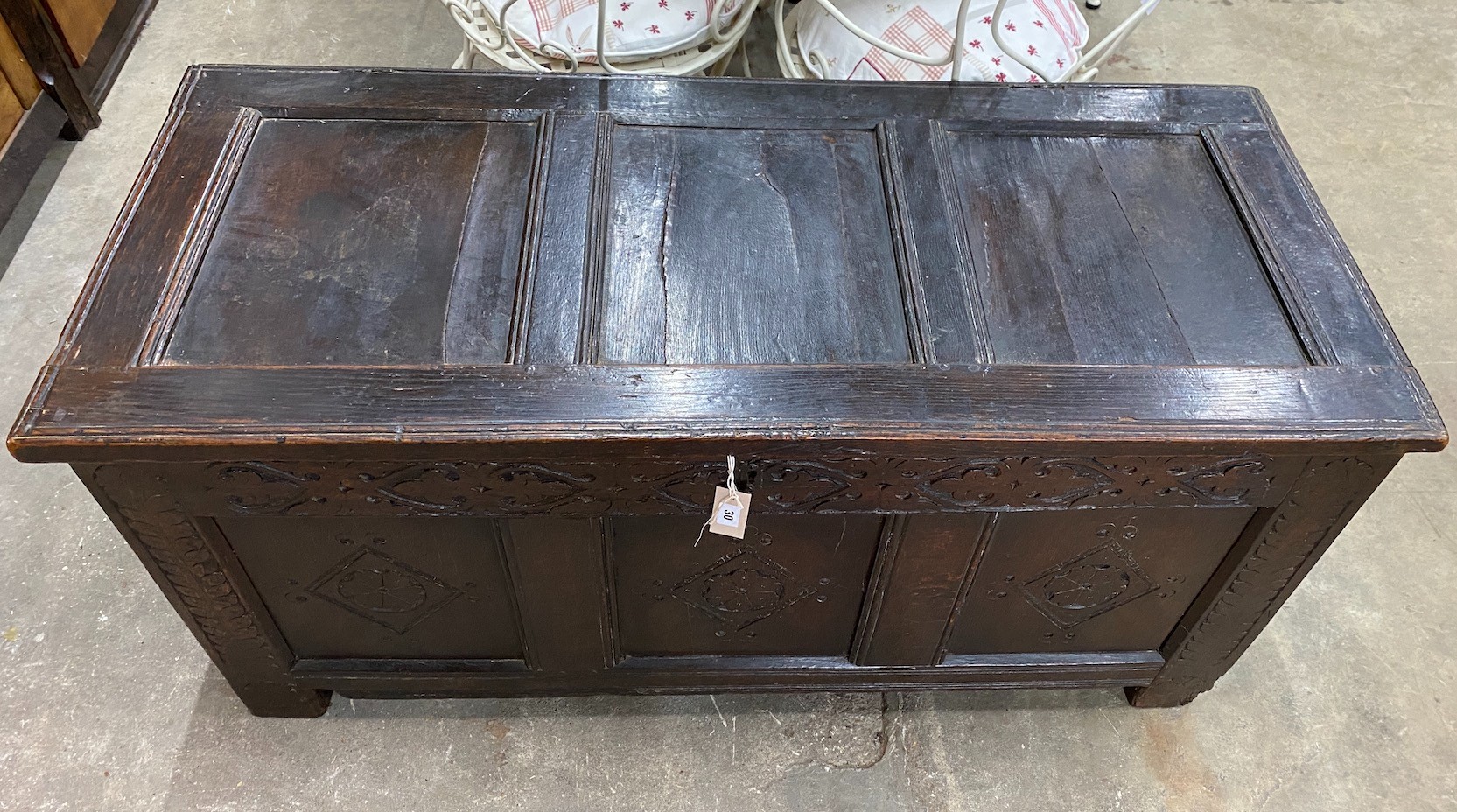 An 18th century carved oak coffer, length 134cm, depth 58cm, height 65cm